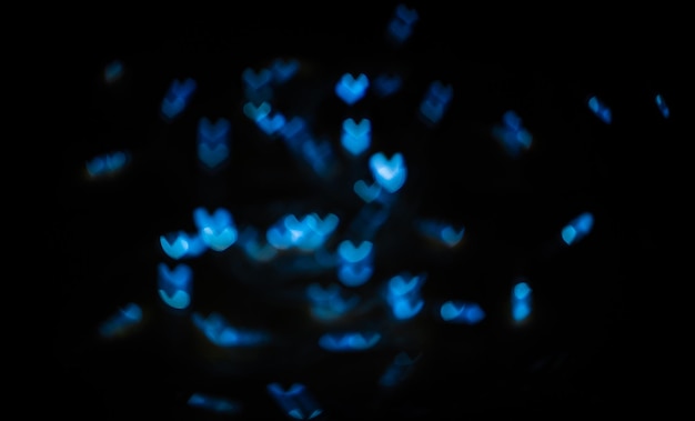 Christmas Banner with blue unfocused lights garlands in form of small hearts