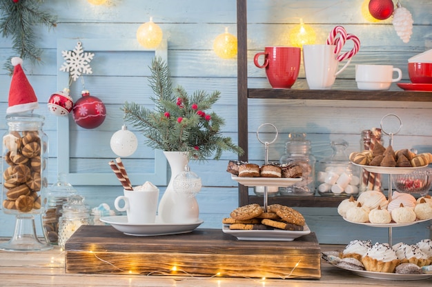 Photo christmas bar cacao decoration with cookies and sweets  in vintage style