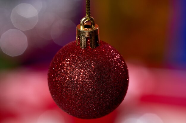 Christmas bauble on bright unfocused backgroundred christmas decorations on blur background