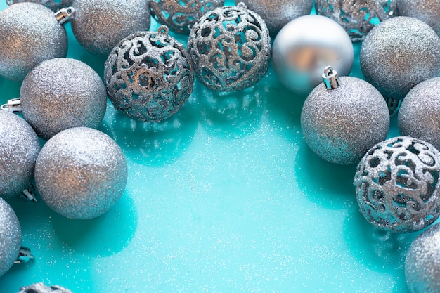 Christmas baubles decoration on blue background.