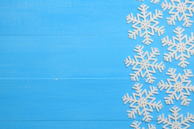 Christmas blue background with snowflakes for New Years holiday