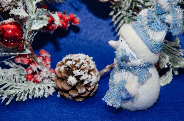 Christmas blue background with stars and snowflakes snowman