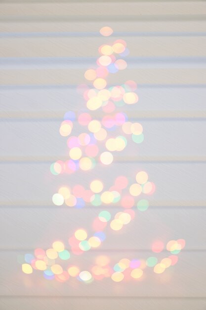 Photo christmas, blur bokeh defocused lights decoration on christmas tree.bokeh light effect.preparing for the holidays christmas.abstract christmas tree shape silhouette