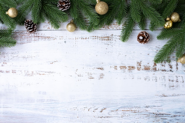 Christmas border background with decorations and wide arch shaped leaf frame on white board  background.