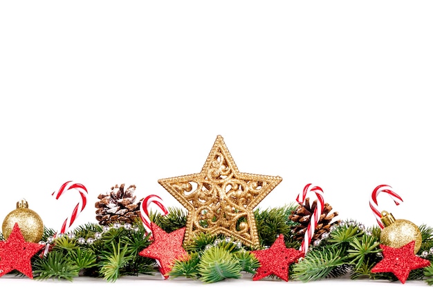 Christmas Border with tree branches with golden balls, candy and big star