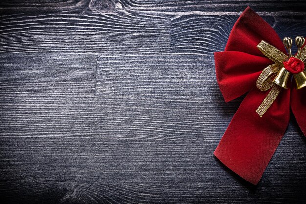 Christmas bow on wooden board copyspace holidays concept