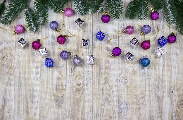 Christmas box of New Year's toys on a wooden background.