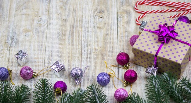 Christmas box of New Year's toys on a wooden background.