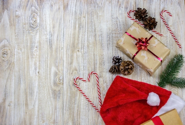 Christmas box of New Year's toys on a wooden background.