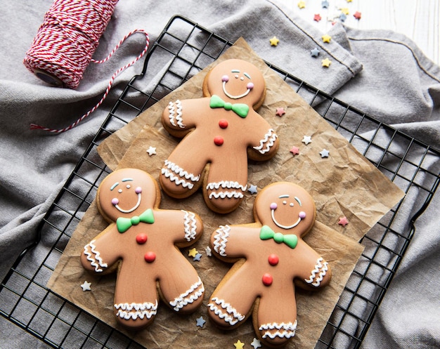 Christmas brown gingerbread man cookies on baking rack