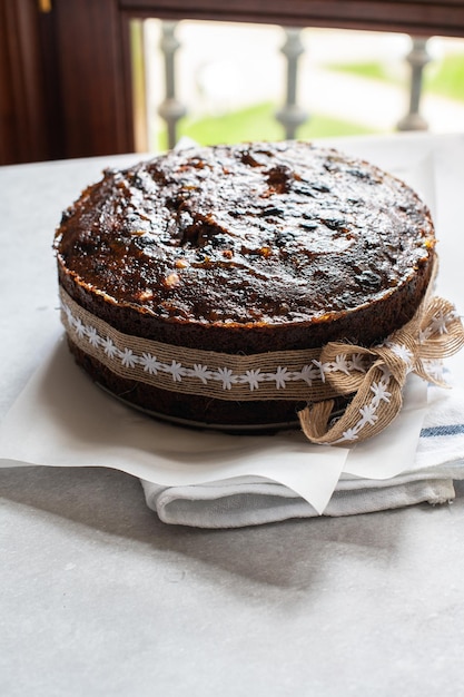 Christmas cake or chocolate pudding with fruits and nuts