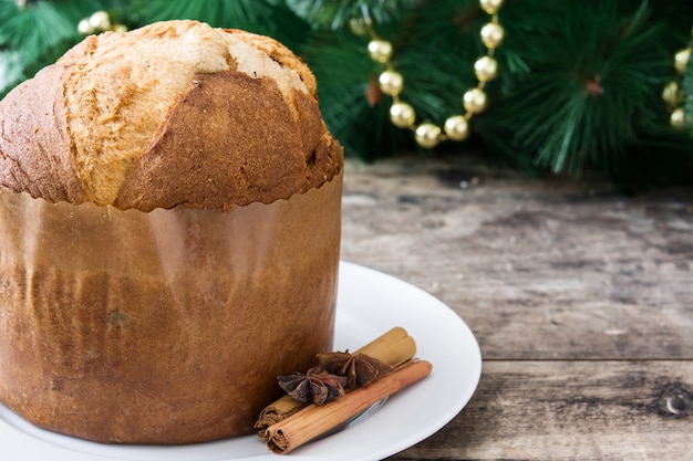 Christmas cake panettone and Christmas decoration on wooden 