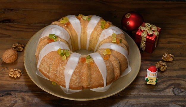 Christmas cake on plate, fruit cake on a wooden board