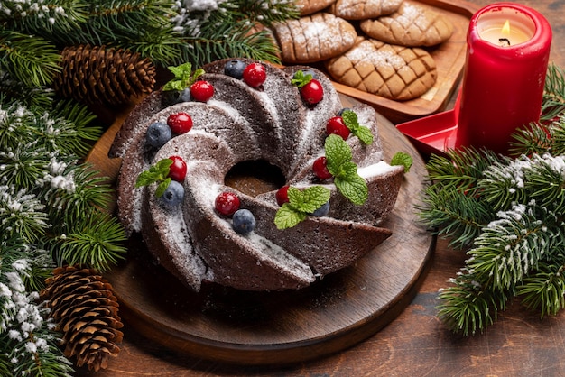 Christmas cake with blueberries cranberries and mint