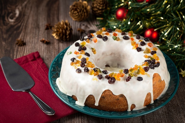 Christmas cake with fondant and candied fruit.