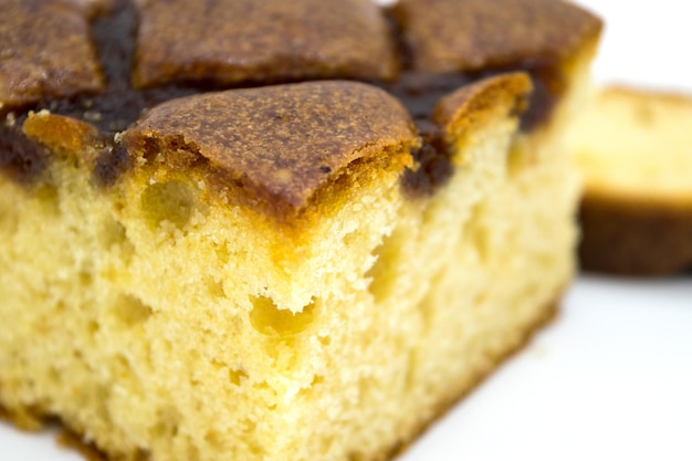 Foto torta di natale con il primo piano della marmellata su una priorità bassa bianca