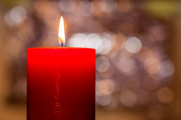 Christmas candle burning at night.