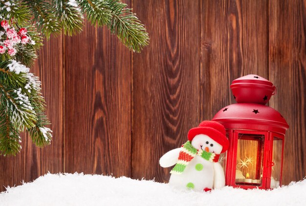 Christmas candle lantern and snowman