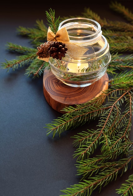 Christmas candle with fir tree branch 