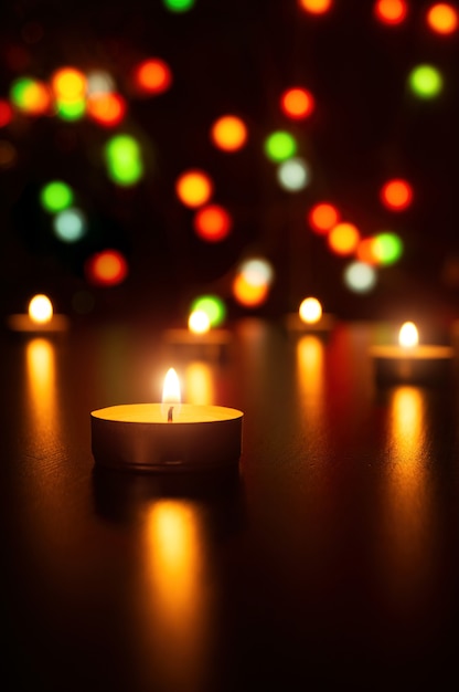 Christmas Candles flame light romantic decoration in defocused lights