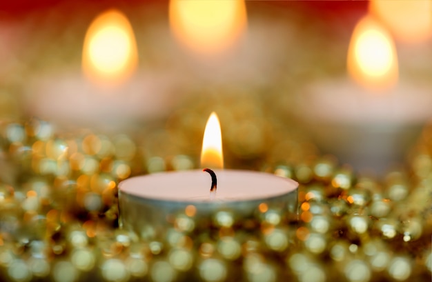 Christmas candles with golden decoration 