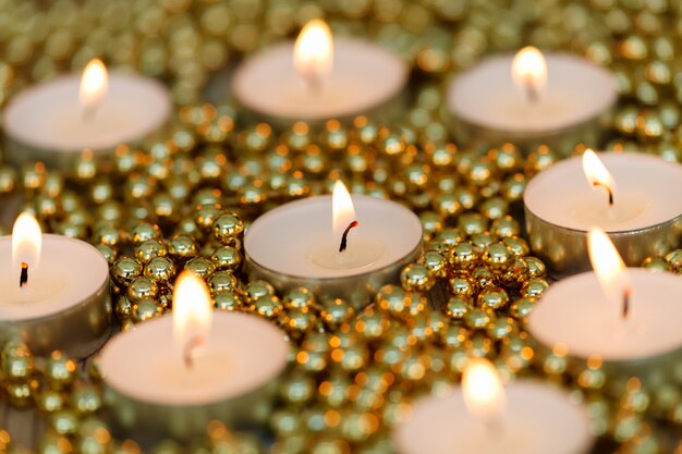 Christmas candles with golden decoration 