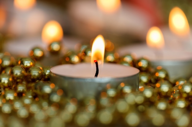 Christmas candles with golden decoration 