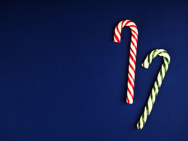 Christmas candy cane on blue