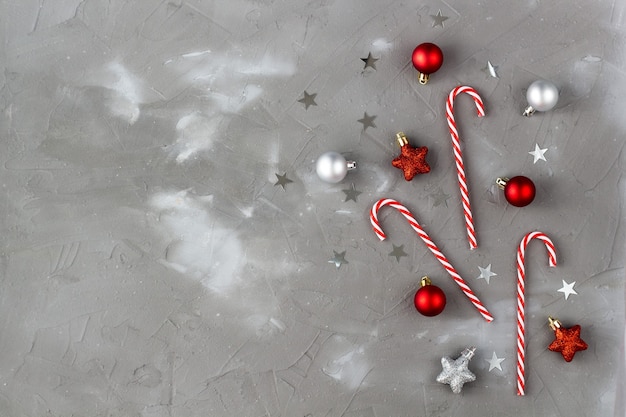 Christmas candy cane red and silver balls stars. New year celebration concept