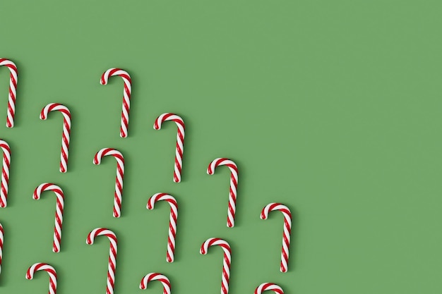 Foto caramelle di natale rosso e bianco dolce festivo su uno sfondo verde d rendering