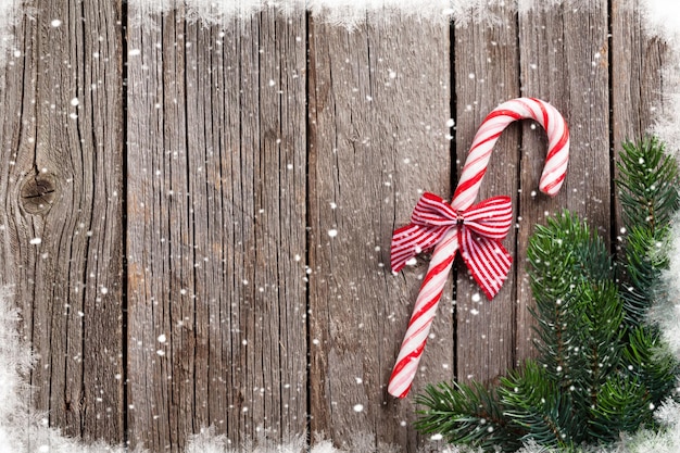 Christmas candy cane on wooden table