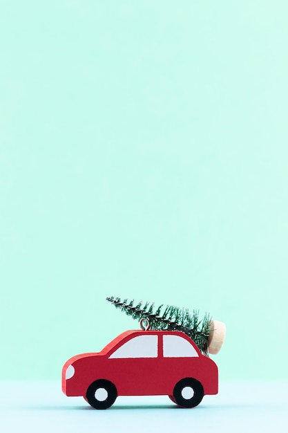 Photo christmas car on pastel color background