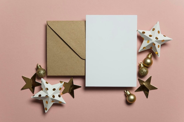 Christmas card template mock up Blank card with envelope on pink background