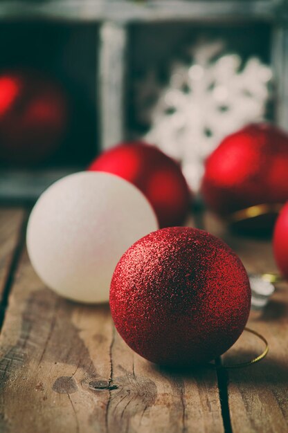 Christmas card with balls on the wooden table