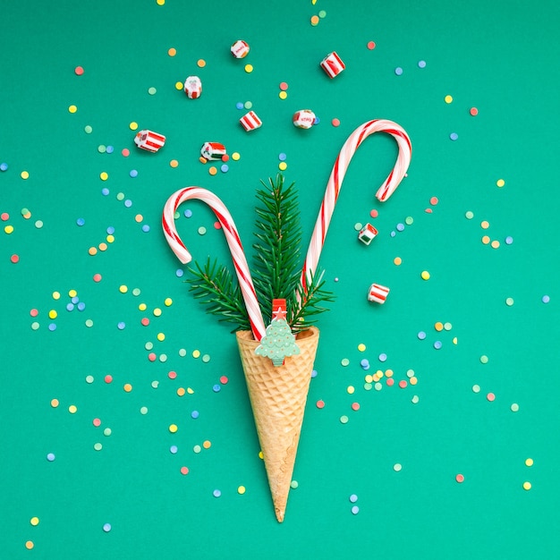 Christmas card with candy canes in waffle cone