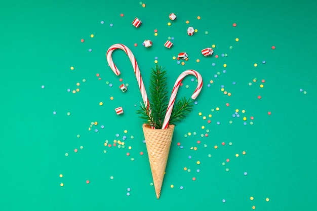 Christmas card with candy canes in waffle cone