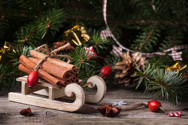 Christmas card with sled and cinnamon