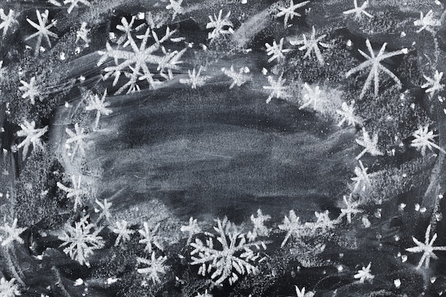 Photo christmas children chalk drawing on black chalkboard