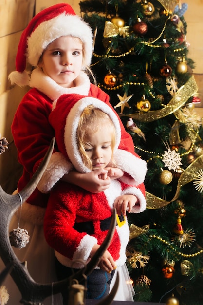 Christmas children at decorated tree