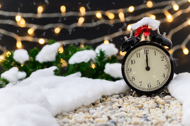 Christmas clock outdoors with snow