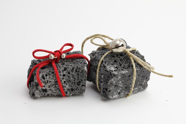 Photo christmas coal with ribbons sweet gift for naughty boys