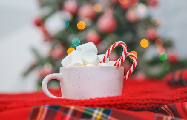 Christmas cocoa with marshmallows and candies. Selective focus.