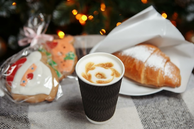 Christmas coffee and croissants with gifts and toys