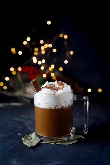 Christmas coffee with cinnamon and foam