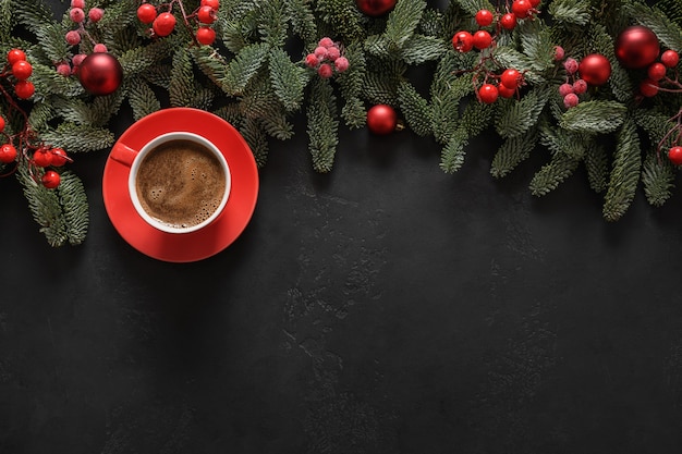 Christmas coffee with nobilis branches red balls xmas greeting card happy new year view from above