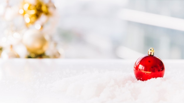 Christmas composition of bauble on table 