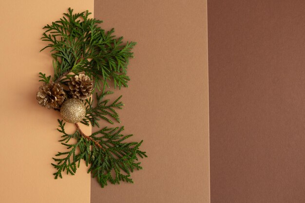 Christmas composition on a brown background spruce christmas balls copy space