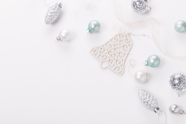 Christmas composition. Christmas balls, blue and silver decorations on white background. Flat lay, top view, copy space