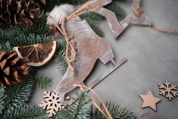 Christmas composition Christmas decorations pine cones fir branches on gray stone background