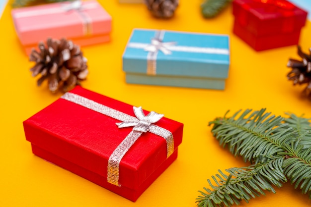 Christmas composition. Christmas gift boxes, fir cones and branches of spruce. Holiday greeting card